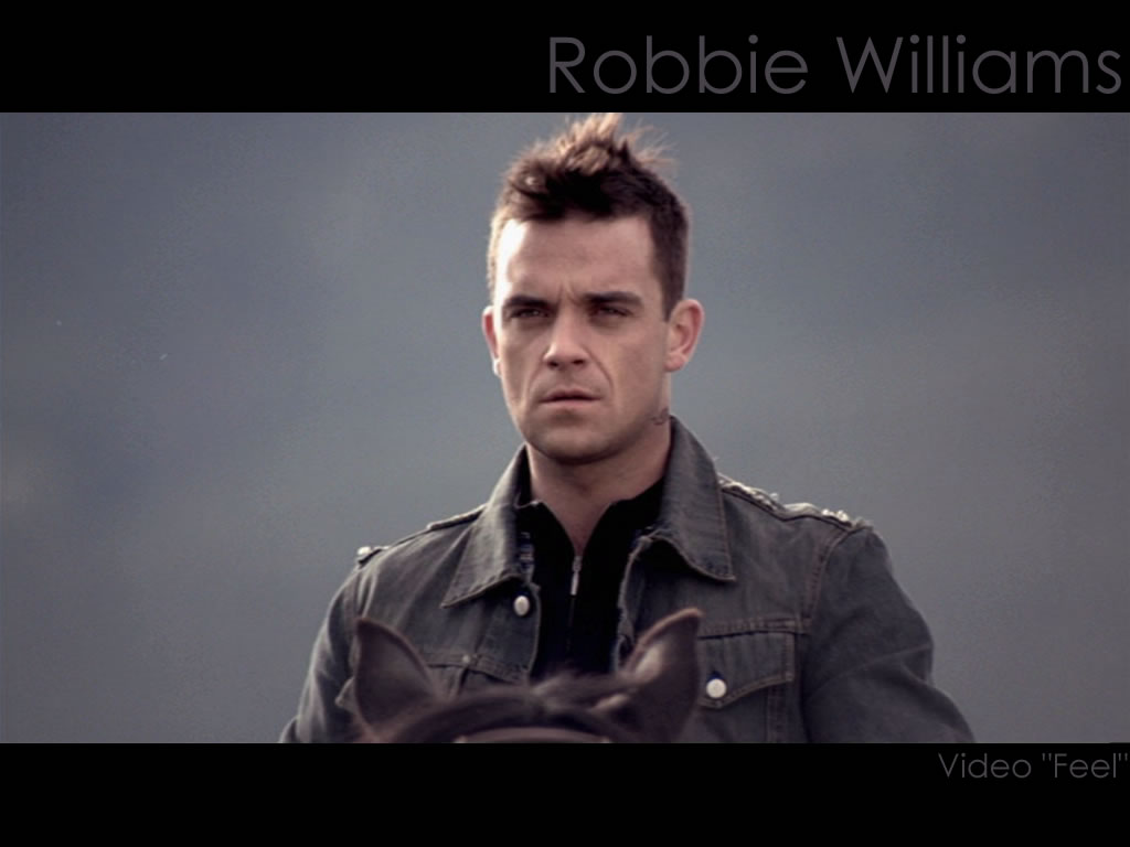 Робби уильямс фил. Робби Уильямс Фил клип. Robbie Williams 2023. Дэрил Ханна в клипе Робби Уильямса.